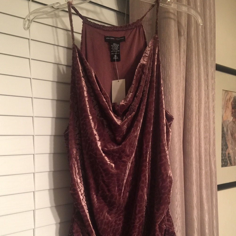 Ladies sleeveless draped top.